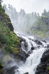 View on Cascade of Låtefossen waterfalls, one of the biggest waterfalls in Norway, Odda 
