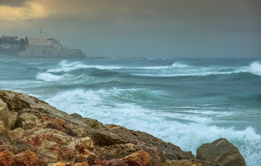 Stony beach of the Mediterranean Sea after stormy weather in center of Tel-Aviv city, Israel