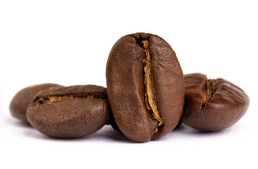 Roasted coffee bean closeup, selective focus, isolated on white