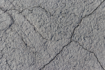 Texture of wet cracked ground as background