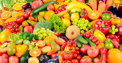 Wide background made of vegetables and fruits. Food concept.