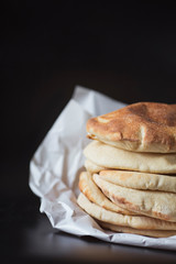 stack of pita bread lavash, healthy homemade traditional eastern flatbread bread lavash, cyprus, turkish bread, on the black background
