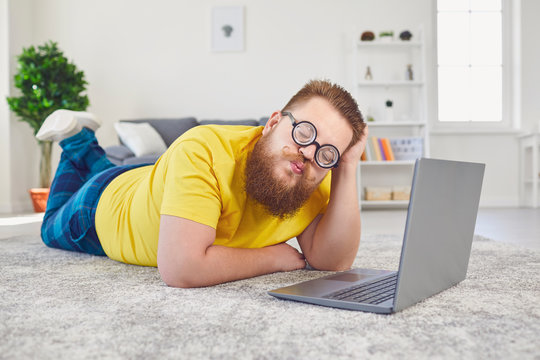 Online Dating Chat Video Chat Call.Funny Fat Man In Glasses Of A Fool With A Laptop On A Date Online Video Call Chat Application In The Room At Home.