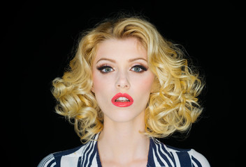 Portrait of beautiful young sexy woman with vintage make-up and hairstyle. Pin-up girl. American style.