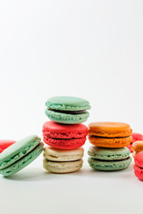 Fototapeta na wymiar Beautiful colorful desserts. French macaroons on a white background 