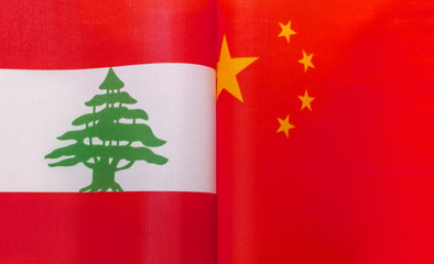 fragments of the national flags of the Lebanese Republic and China close up