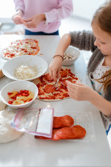 mother and daughter preparing food