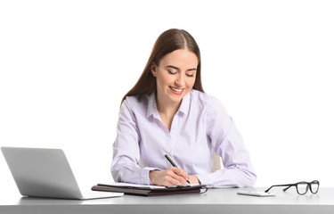 Beautiful young secretary at table on white background