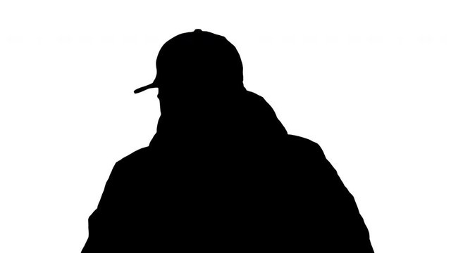 Silhouette Man in winter outfit walking and coughing.