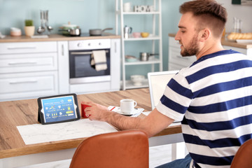 Man using application of smart home automation