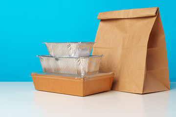 Assortment of various food delivery containers on table close up