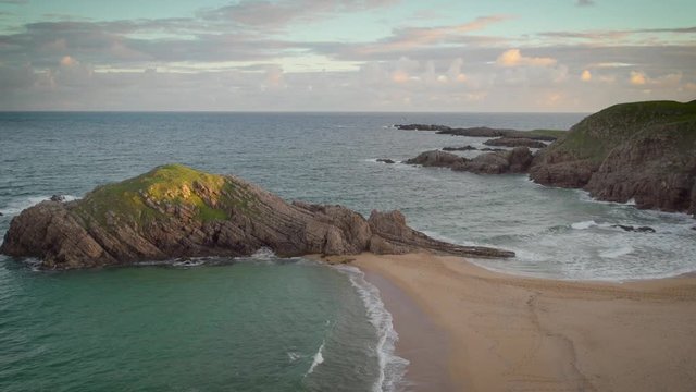 Murder Hole Beach at sunrise in Donegal, Ireland. Panning.