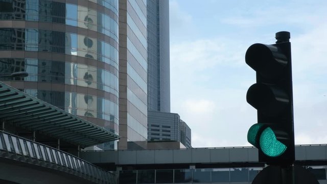 Traffic light turns from red to green at financial district intersection. Hong Kong.