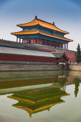 Fototapeta premium Reflections of a building outside the Forbidden City landmark in Beijing, China on a summer day