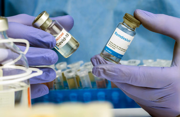 Scientific has two vials with medication for people infected by Sars-CoV-2, Remdesivir is a...