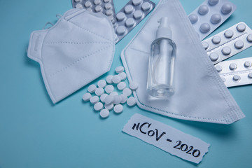 CORONAVIRUS concept flat lay on blue background