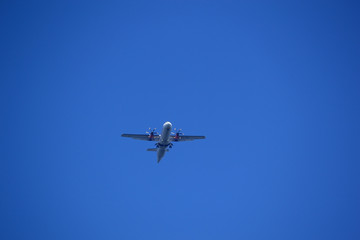 Fototapeta na wymiar Air Plane is flying in blue sky 