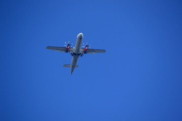 Fototapeta na wymiar Air Plane is flying in blue sky 