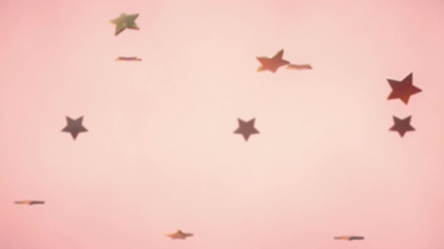 3d animation: Abstract looped background with lots of falling and rotating golden stars on pink-peach background. Holiday and party moving wallpapper.
