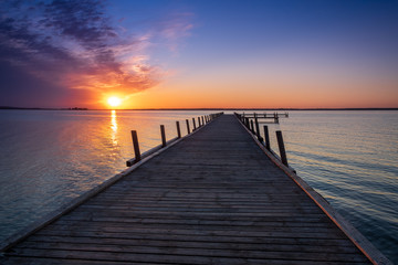 Fototapeta premium Beautiful romantic sunset over a calm lake