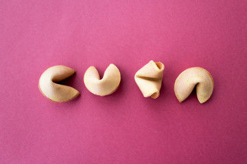 Obraz premium The fortune cookies on red background. Flat lay style