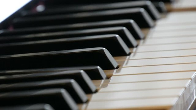 An interesting mystical self-playing piano. Black and white piano keys that play on their own