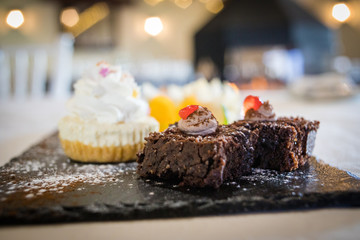 Close up image of delicious chocolate brownies served as desert in a gourmet restaurant