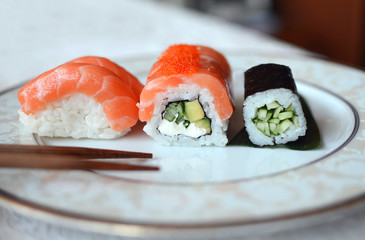 rolls and sushi on a white background