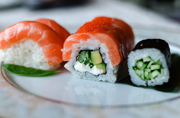 rolls and sushi on a white background