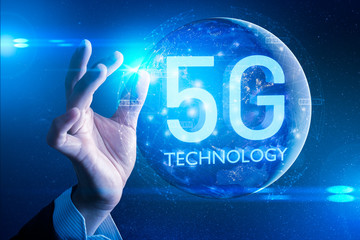 The abstract image of businessman using a smartphone overlay with 5g and cityscape hologram and element of this image furnished by Nasa. the concept of 5G, communication, network, connection, internet