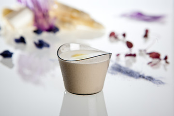 White garlic cream in the plastic glass for professional catering