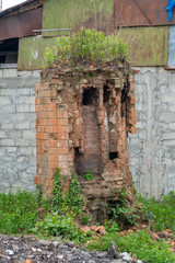 Abandoned brick fireplace and chimney, An old abandoned fireplace