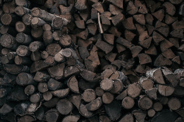 wooden background. chopped firewood. stack 