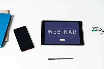 Tablet computer for online training webinars. E-learning browsing connection and cloud online technology webcast concept. tablet mockup with clipping path on screen.