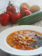 Pickle soup with barley groats and vegetables. Russian traditional soup Rassolnik.