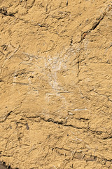Close-up view of old clay surface. Abstract background, clay texture. Vintage aged clay background texture. The wall of abandoned barn. Outdoor and indoor interiors