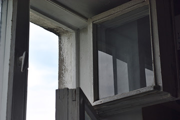 fragment of an open old wooden window