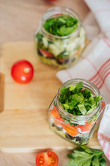 Healthy Homemade Jar Salad with cucumbers and tomatoes. Healthy food, Diet, Detox, Clean Eating or Vegetarian concept.