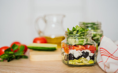 Healthy Homemade Jar Salad with cucumbers and tomatoes. Healthy food, Diet, Detox, Clean Eating or Vegetarian concept.