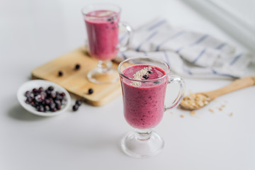 delicious berry smoothie on a wooden Board on a light background