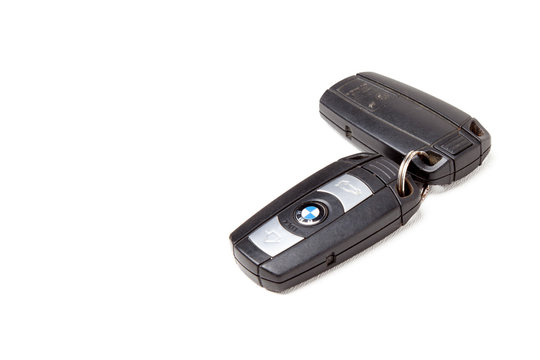 Key BMW brand keychain with chip - central locking control panel with  dynamic code isolated on a white background in a photo studio. Old key from  a German car at an auto-parsing.