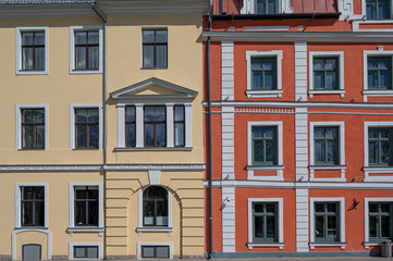 Colorful facade with yellow and red of historic buildings