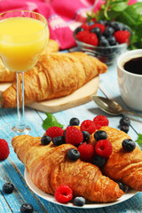 Croissants with fresh berries for breakfast	