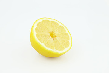 Half of ripe fresh lemon isolated on white background. Yellow fresh sliced lemon separated on white background