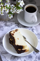 Lviv cheesecake, a traditional Ukrainian dessert with raisins, coated with chocolate icing.