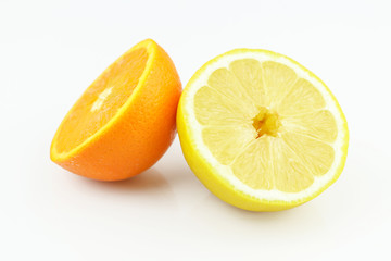 Fresh lemon and orange halves isolated on white background. Yellow fresh sliced lemon and orange separated on white background
