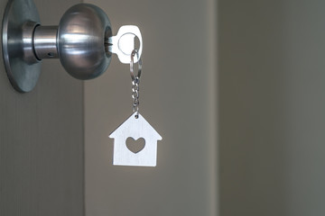 House key with home keyring in keyhole