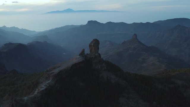 Pico de las nieves, roque nublo, gran canaria, teide teneriffa in the background beautiful cinematic panorama drone aerial fly arround shot at evening 30p
