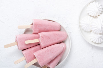 Homemade strawberry ice cream and cookies on a plate on the table. Summer healthy eating concept with copy space.