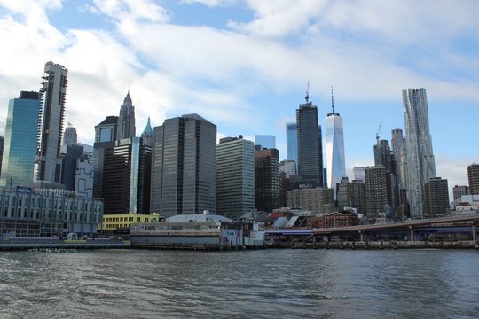 New York, USA - 20/12/2019: One world trade centre Building, observation tower Manhattan New York skyline skyscraper  from ferry approaching downtown city. stock photo
